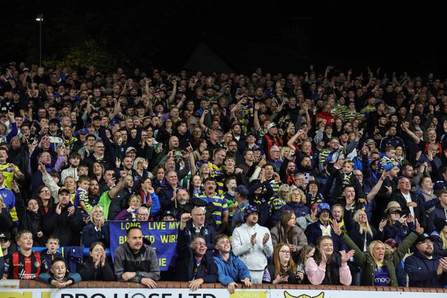 Warrington fans celebrate the win as they book their place in the final at Old Trafford during the Betfred Super League Play-off Semi-Final match Leeds Rhinos vs Warrington Wolves at AMT Headingley Stadium, Leeds, United Kingdom on 25 September 2026

(Photo by Mark Cosgrove/News Images)