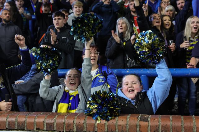 Warrington fans celebrate the win as they book their place in the final at Old Trafford during the Betfred Super League Play-off Semi-Final match Leeds Rhinos vs Warrington Wolves at AMT Headingley Stadium, Leeds, United Kingdom on 25 September 2026

(Photo by Mark Cosgrove/News Images)