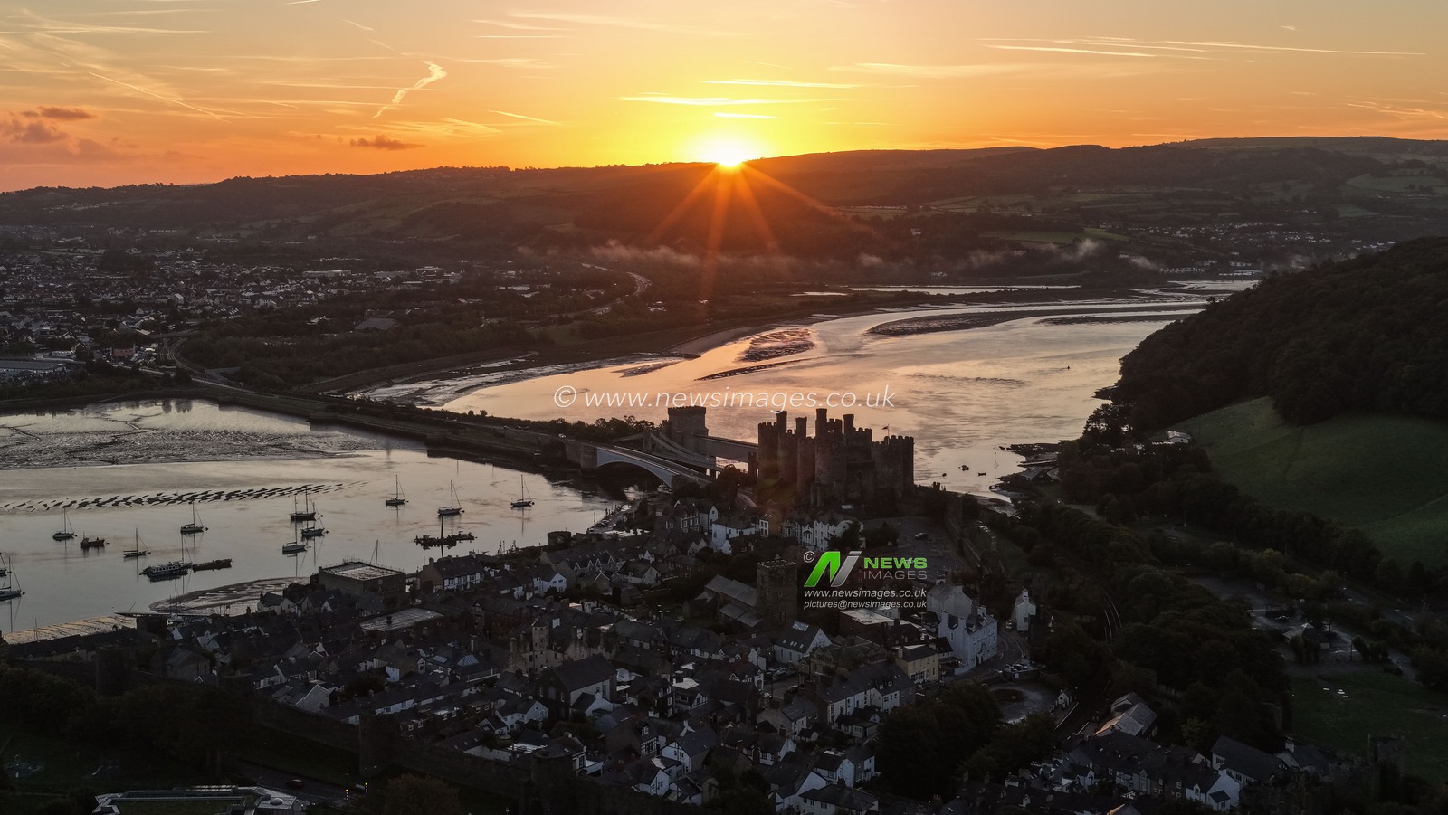 A spectacular sunrise breaks over the historic Conwy Castle, bathing the medieval fortress and surrounding landscape in dramatic golden light in Conwy, Wales, United Kingdom, on 3 October 2026.

(Photo by Mark Cosgrove/News Images)