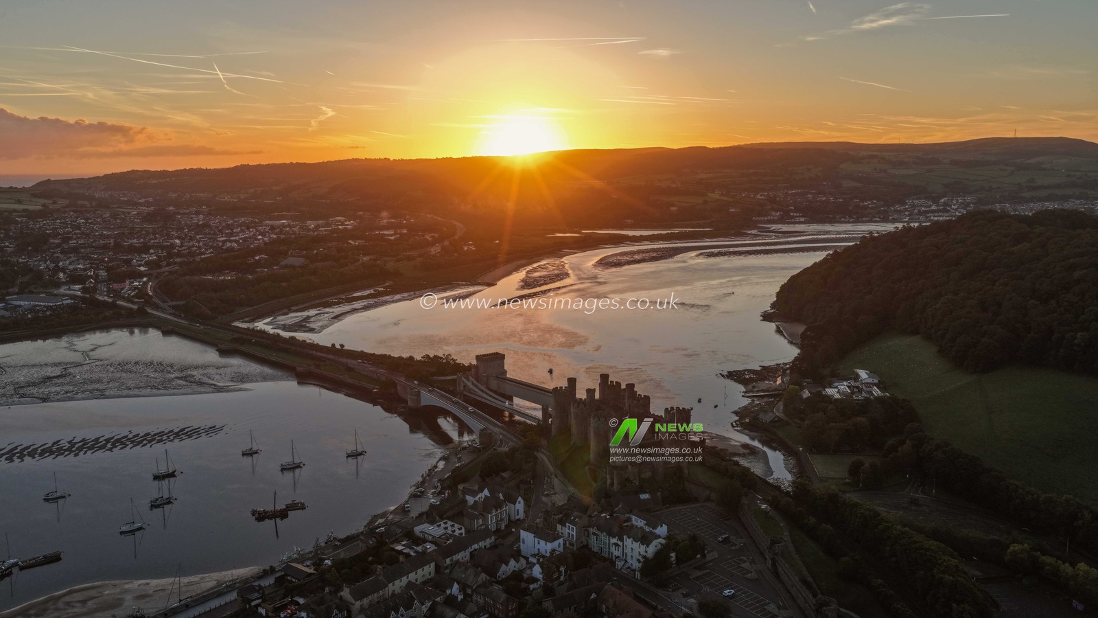 A spectacular sunrise breaks over the historic Conwy Castle, bathing the medieval fortress and surrounding landscape in dramatic golden light in Conwy, Wales, United Kingdom, on 3 October 2026.

(Photo by Mark Cosgrove/News Images)