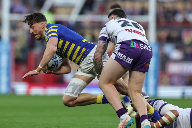 Matty Ashton of Warrington Wolves is tackled during the Betfred Super League Grand Final match Warrington Wolves vs Wakefield Trinity at Old Trafford, Manchester, United Kingdom on 03 October 2026

(Photo by Mark Cosgrove/News Images)