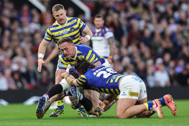 Tom Johnstone of Wakefield Trinity is tackled by James Bentley of Warrington Wolves and Ben Currie of Warrington Wolves  during the Betfred Super League Grand Final match Warrington Wolves vs Wakefield Trinity at Old Trafford, Manchester, United Kingdom on 03 October 2026

(Photo by Mark Cosgrove/News Images)