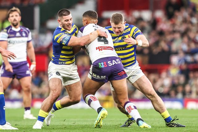 Corey Hall of Wakefield Trinity is tackled by Danny Walker of Warrington Wolves and Luke Yates of Warrington Wolves during the Betfred Super League Grand Final match Warrington Wolves vs Wakefield Trinity at Old Trafford, Manchester, United Kingdom on 03 October 2026

(Photo by Alfie Cosgrove/News Images)