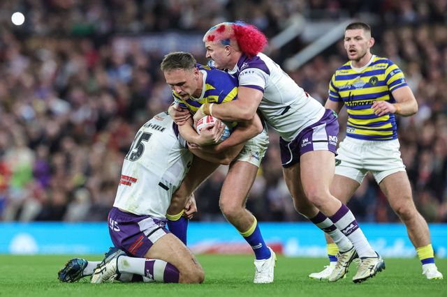 Ben Currie of Warrington Wolves is tackled by Caleb Hamlin-Uele of Wakefield Trinity and Caius Faatili of Wakefield Trinity during the Betfred Super League Grand Final match Warrington Wolves vs Wakefield Trinity at Old Trafford, Manchester, United Kingdom on 03 October 2026

(Photo by Mark Cosgrove/News Images)