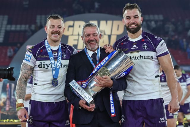 Tom Johnstone of Wakefield Trinity Daryl Powell manager of Wakefield Trinity and Mike McMeeken of Wakefield Trinity with The Betfred Super League Grand Final Trophy during the Betfred Super League Grand Final match Warrington Wolves vs Wakefield Trinity at Old Trafford, Manchester, United Kingdom on 03 October 2026

(Photo by Mark Cosgrove/News Images)