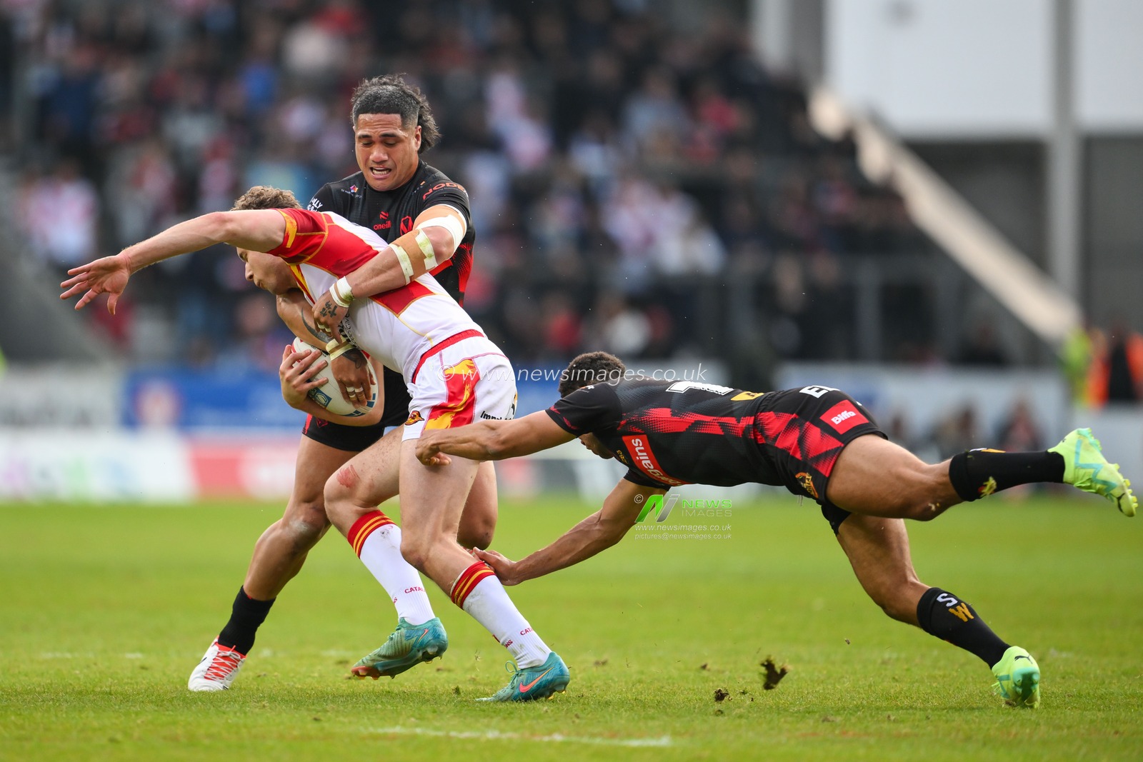 Matthieu Laguerre of Catalan Dragons is tackled by Sione Mataâ€™utia of St. Helens during the Betfred Super League Round 13 match St Helens vs Catalans Dragons at Totally Wicked Stadium, St Helens, United Kingdom, 31st May 2024

(Photo by Craig Thomas/News Images)