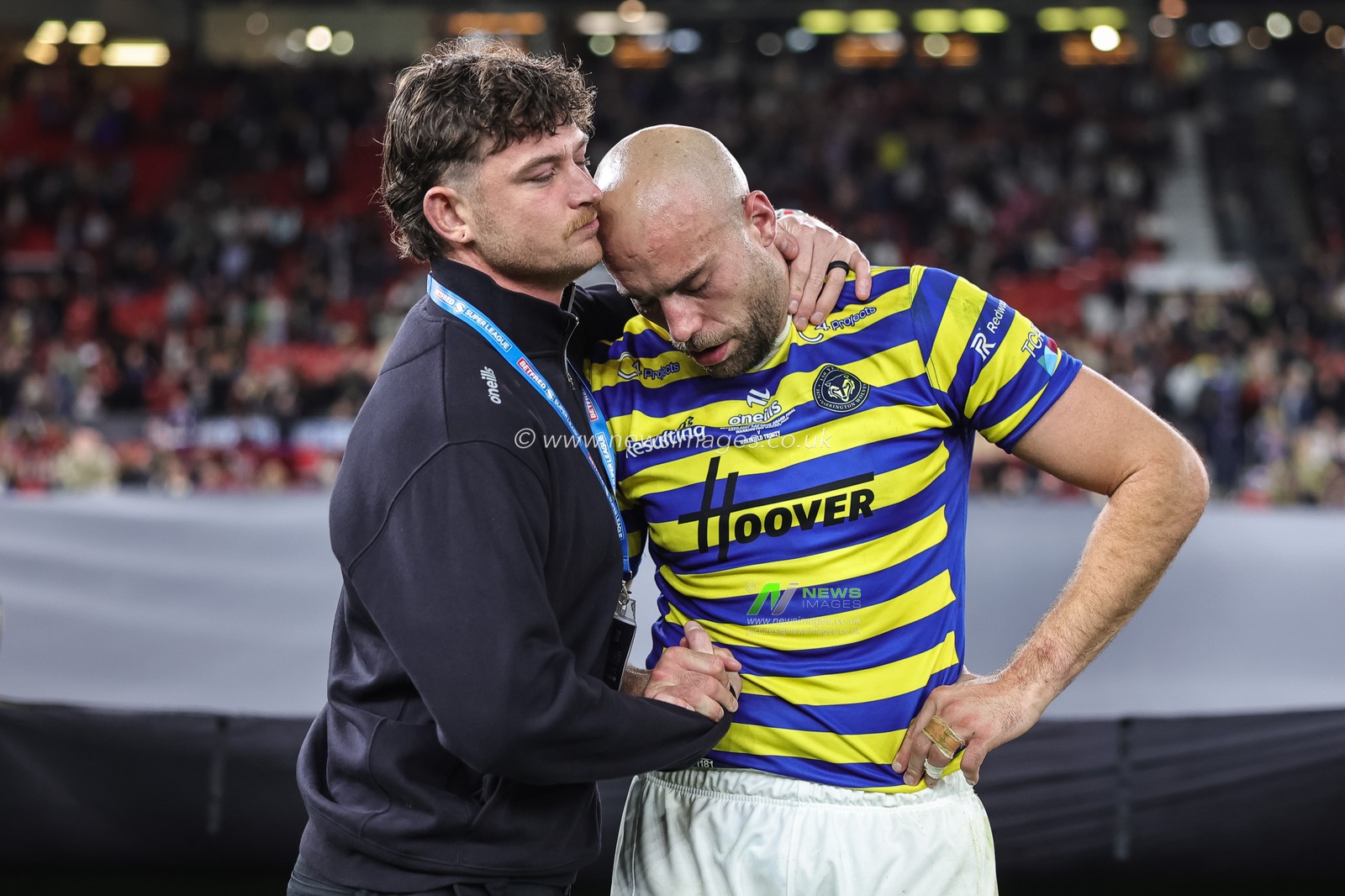 Jordy Crowther of Warrington Wolves consoles James Harrison of Warrington Wolves during the Betfred Super League Grand Final match Warrington Wolves vs Wakefield Trinity at Old Trafford, Manchester, United Kingdom on 03 October 2026

(Photo by Mark Cosgrove/News Images)