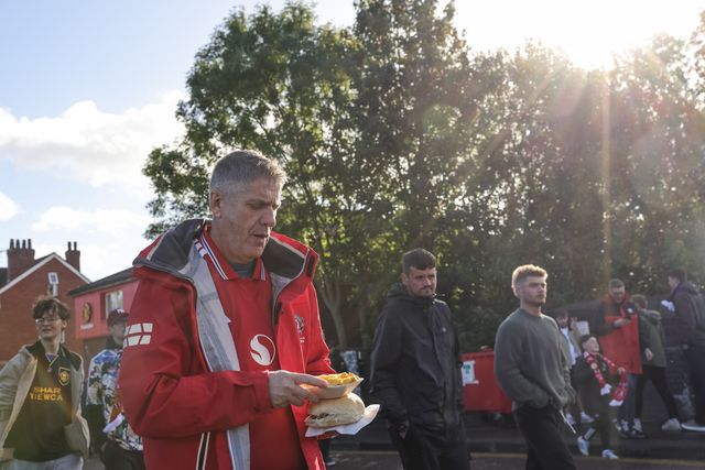 Manchester United fans make their way to Old Trafford during the Premier League match Manchester United vs Tottenham Hotspur at Old Trafford, Manchester, United Kingdom on 10 October 2026

(Photo by Mark Cosgrove/News Images)