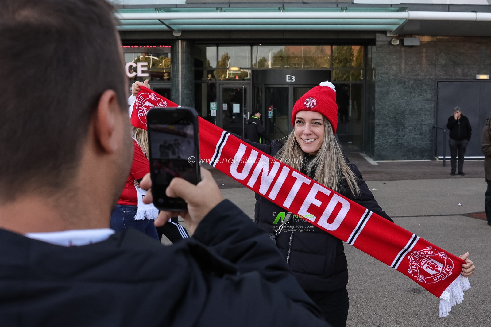 Manchester United fans pose for a selfie during the Premier League match Manchester United vs Tottenham Hotspur at Old Trafford, Manchester, United Kingdom on 10 October 2026

(Photo by Mark Cosgrove/News Images)