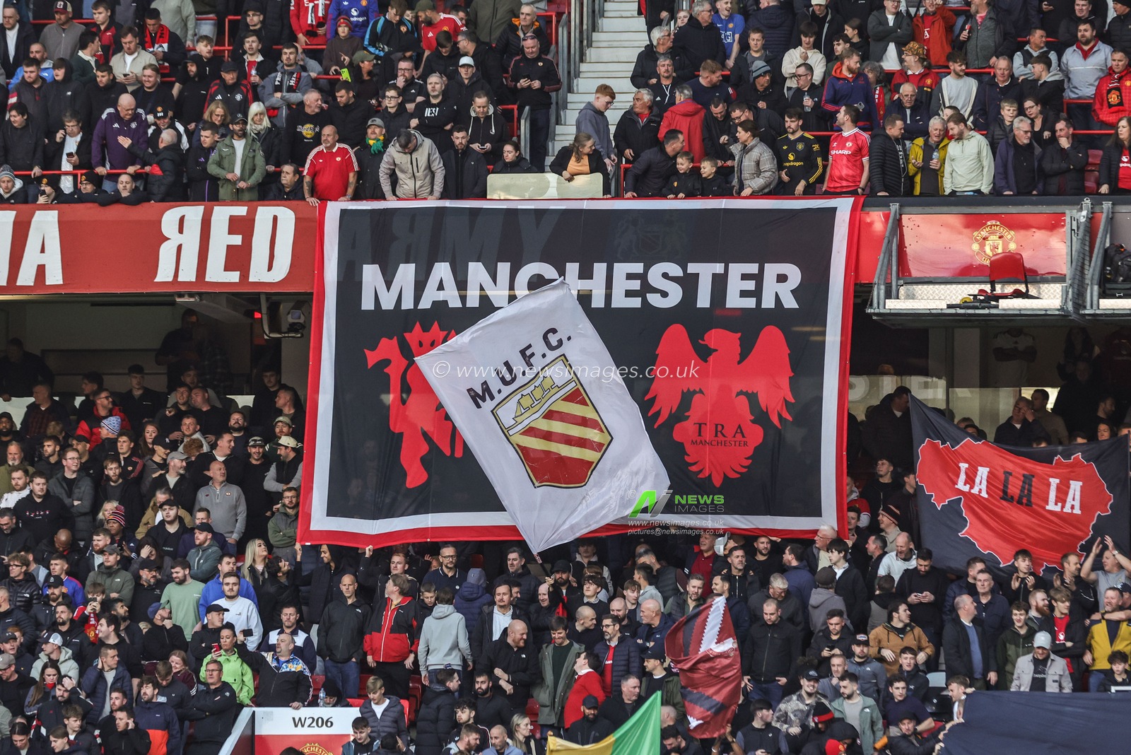 Manchester United fans hold up flags before the Premier League match Manchester United vs Tottenham Hotspur at Old Trafford, Manchester, United Kingdom on 10 October 2026

(Photo by Mark Cosgrove/News Images)