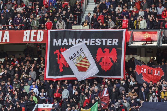 Manchester United fans hold up flags before the Premier League match Manchester United vs Tottenham Hotspur at Old Trafford, Manchester, United Kingdom on 10 October 2026

(Photo by Mark Cosgrove/News Images)