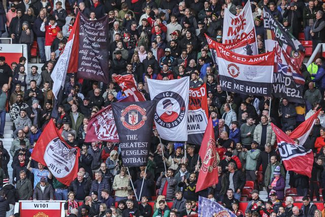 Manchester United fans hold up flags before the Premier League match Manchester United vs Tottenham Hotspur at Old Trafford, Manchester, United Kingdom on 10 October 2026

(Photo by Mark Cosgrove/News Images)