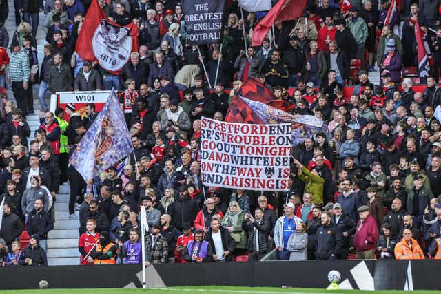 Manchester United fans hold up flags before the Premier League match Manchester United vs Tottenham Hotspur at Old Trafford, Manchester, United Kingdom on 10 October 2026

(Photo by Mark Cosgrove/News Images)