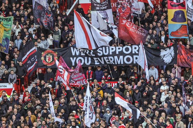 Manchester United fans hold up flags before the Premier League match Manchester United vs Tottenham Hotspur at Old Trafford, Manchester, United Kingdom on 10 October 2026

(Photo by Mark Cosgrove/News Images)