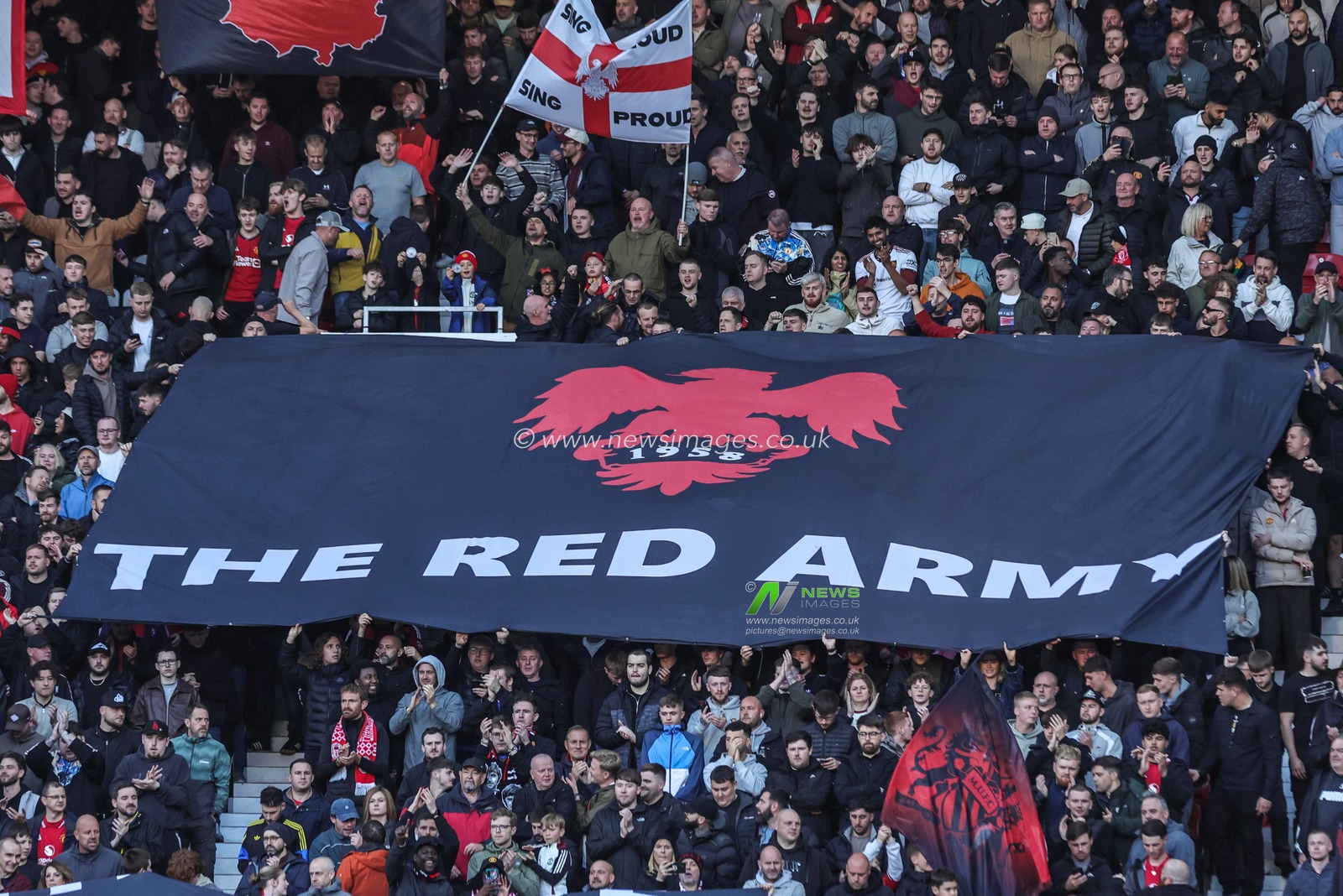 Manchester United fans hold up flags before the Premier League match Manchester United vs Tottenham Hotspur at Old Trafford, Manchester, United Kingdom on 10 October 2026

(Photo by Mark Cosgrove/News Images)