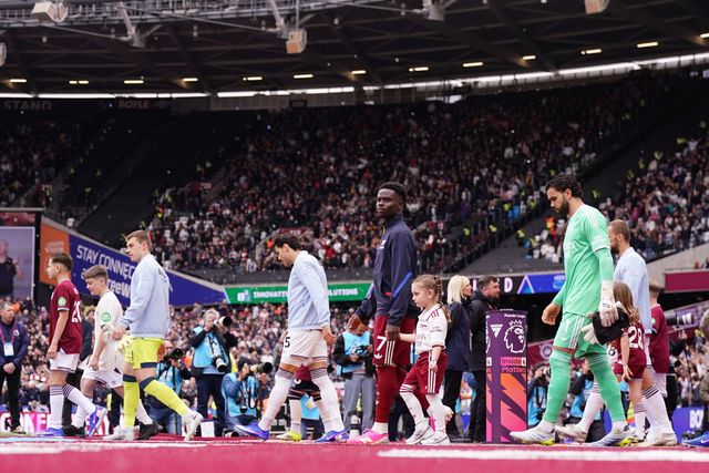 Both sets of players walk out ahead of kick off during the Premier League match West Ham United vs Arsenal at London Stadium, London, United Kingdom on 10 May 2026

(Photo by Harvey Murphy/News Images)