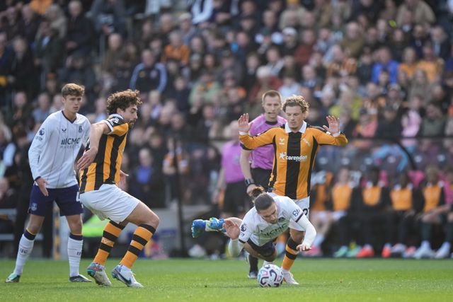 Jack Grealish of Everton is tackled by  Regan Slater of Hull City during the Premier League match Hull City vs Everton at MKM Stadium, Hull, United Kingdom on 11 October 2026

(Photo by Maynard Manyowa/News Images)