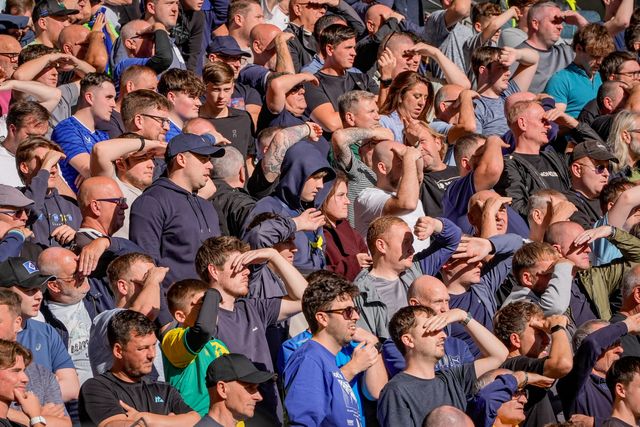 Everton fans shield their eyes from the sun during the Premier League match Hull City vs Everton at MKM Stadium, Hull, United Kingdom on 11 October 2026

(Photo by Maynard Manyowa/News Images)