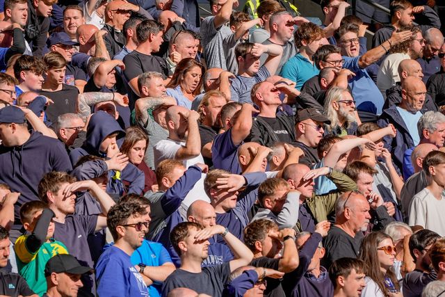 Everton fans shield their eyes from the sun during the Premier League match Hull City vs Everton at MKM Stadium, Hull, United Kingdom on 11 October 2026

(Photo by Maynard Manyowa/News Images)