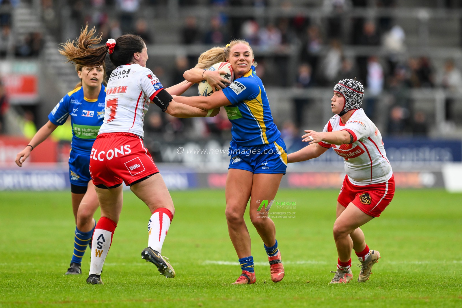 Lucy Murray of Leeds Rhinos fends off Faye Gaskin of St Helens during the Betfred Women's Super League match St Helens vs Leeds Rhinos at Totally Wicked Stadium, St Helens, United Kingdom, 24th May 2024

(Photo by Craig Thomas/News Images)