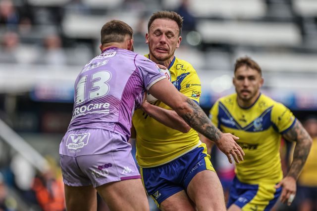 Ben Currie of Warrington Wolves is tackled by Kaide Ellis of Wigan Warriors during the Betfred Magic Weekend 2025 match Huddersfield Giants vs Hull FC at St. James's Park, Newcastle, United Kingdom, 4th May 2025

(Photo by Mark Cosgrove/News Images)