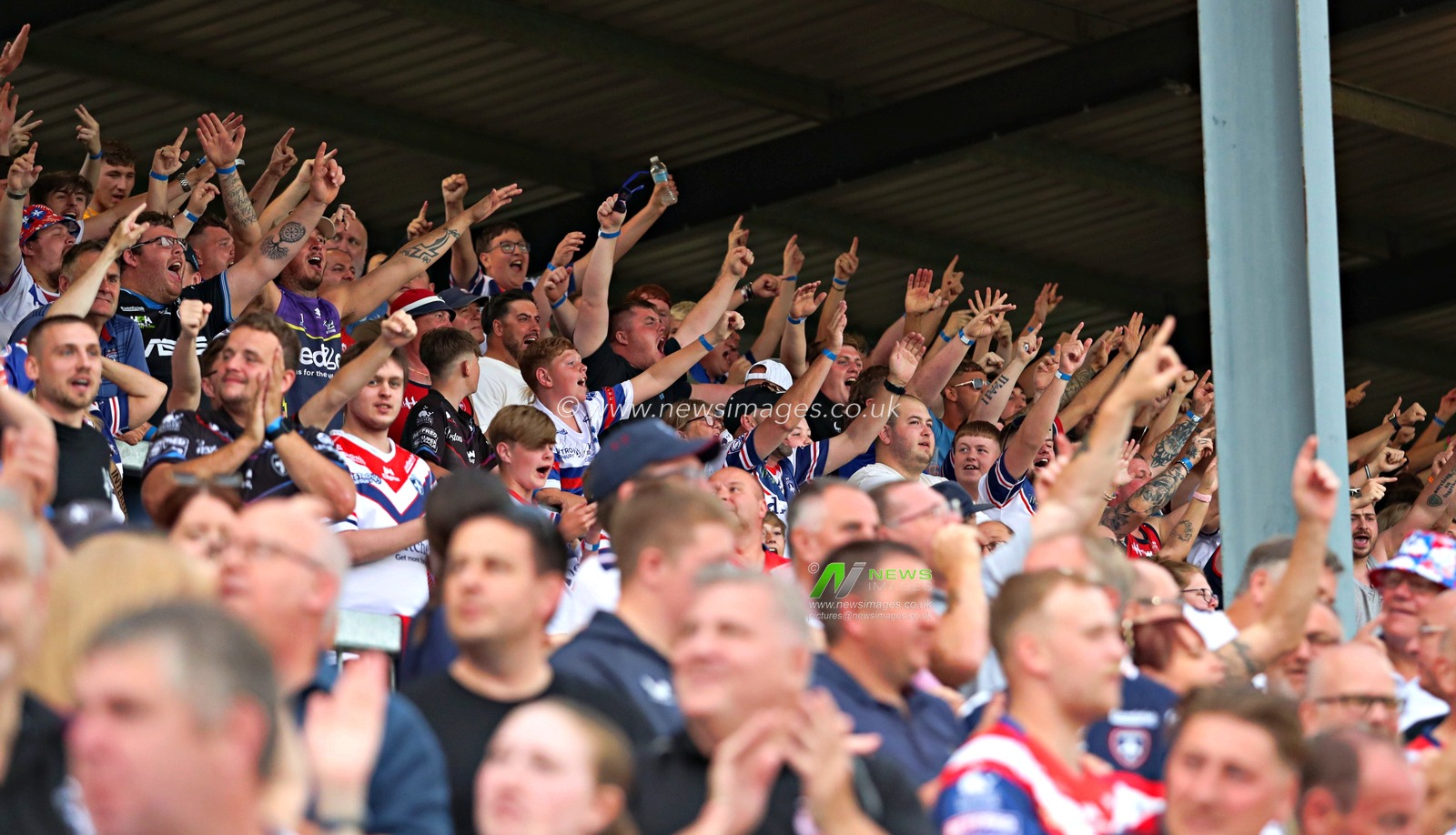 Wakefield fans celebrate the try scored by Caius Faatili of Wakefield Trinity during the Betfred Super League round 15 match Wakefield Trinity vs Wigan Warriors at DIY Kitchens Stadium, Wakefield, United Kingdom, 20th June 2025

(Photo by Sam Eaden/News Images)