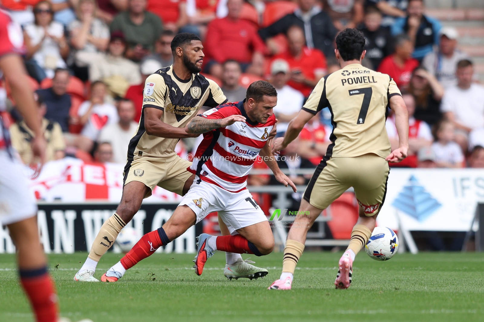Billy Sharp of Doncaster Rovers is fouled by Zak Jules of Rotherham United during the Sky Bet League 1 match Doncaster Rovers vs Rotherham United at Eco-Power Stadium, Doncaster, United Kingdom, 30th August 2025

(Photo by Alex Roebuck/News Images)