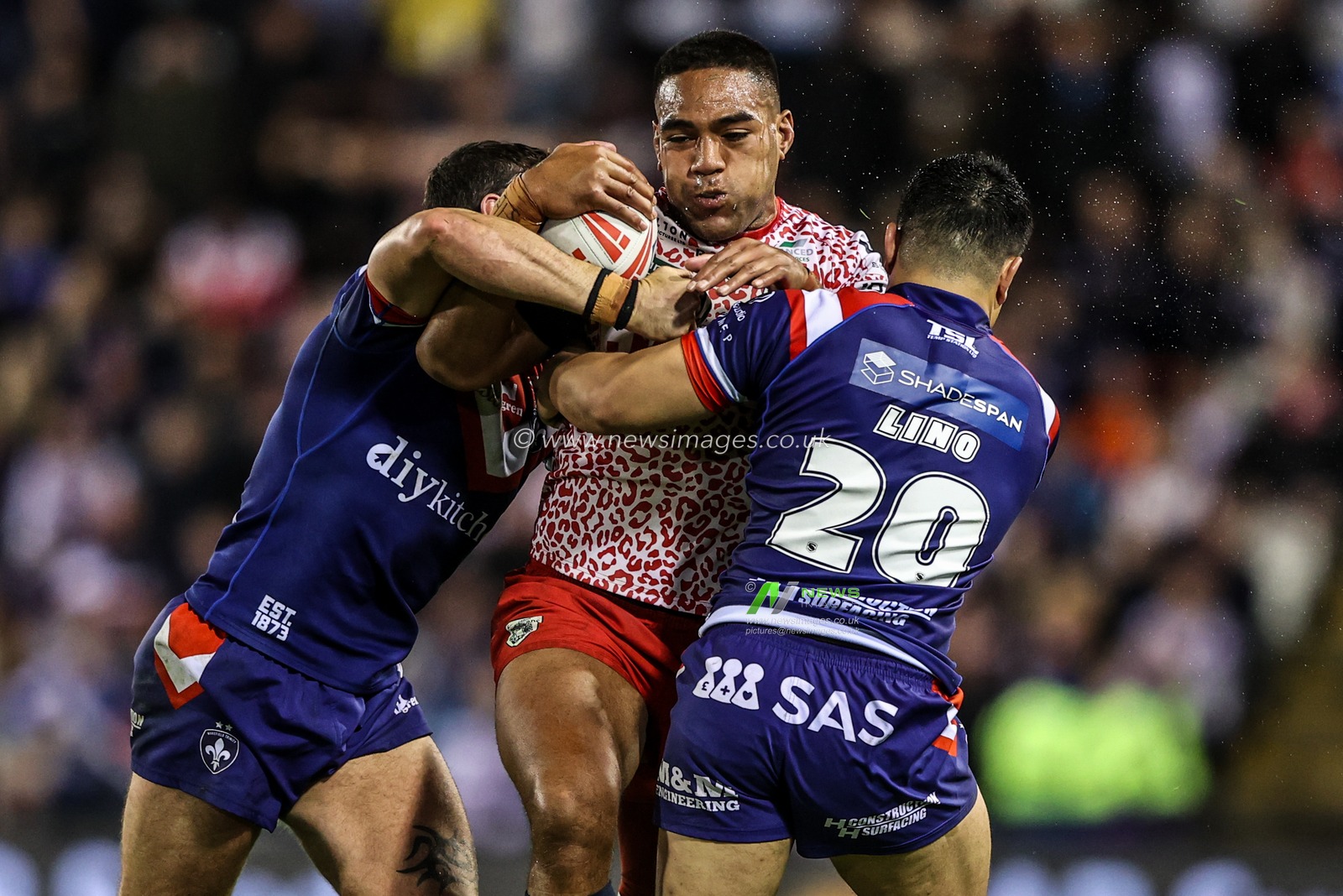 Joe Ofahengaue of Leigh Leapords is tackled by Jay Pitts of Wakefield Trinity and Mason Lino of Wakefield Trinity during the Betfred Super League play-off Eliminator 1 match Leigh Leopards vs Wakefield Trinity at Progress With Unity Stadium, Leigh, United Kingdom, 26th September 2025

(Photo by Alfie Cosgrove/News Images)