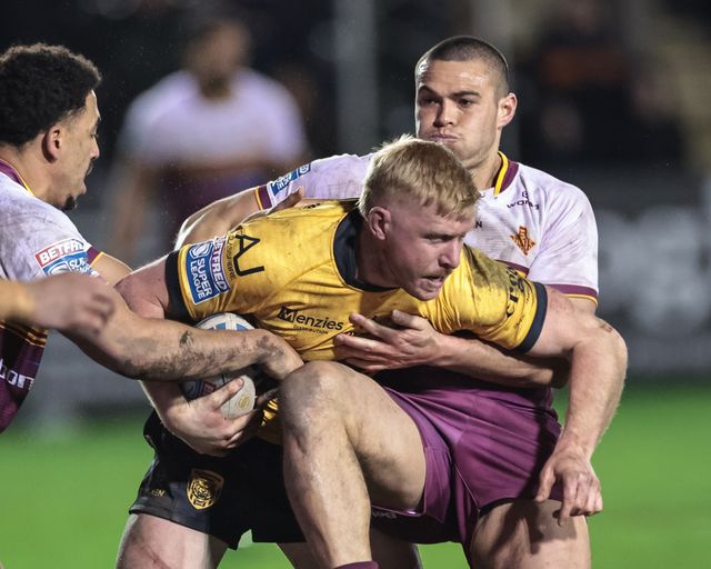 Zac Cini of Castleford Tigers is tackled by Tui Lolohea of Huddersfield Giants during the Betfred Super League Round 3 match Castleford Tigers vs Huddersfield Giants at OneBore Stadium, Castleford, Untied Kingdom on 27 February 2026

(Photo by Mark Cosgrove/News Images)