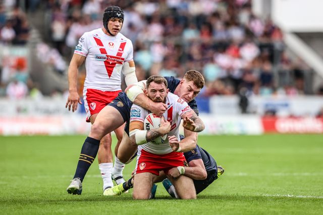Daryl Clark of St. Helens is tackled during the Betfred Super League round 16 match St Helens vs Salford Red Devils at Totally Wicked Stadium, St Helens, United Kingdom, 29th June 2025

(Photo by Alfie Cosgrove/News Images)