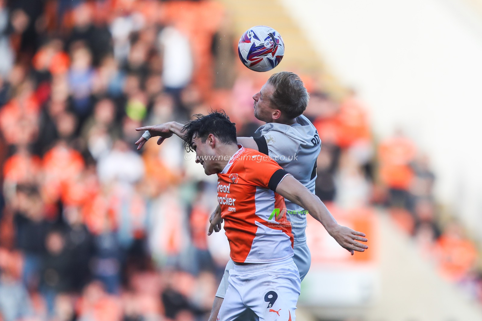 Kyle Joseph of Blackpool and Marc Roberts of Barnsley battle for the ball during the Sky Bet League 1 match Blackpool vs Barnsley at Bloomfield Road, Blackpool, United Kingdom, 19th October 2024

(Photo by Gareth Evans/News Images)