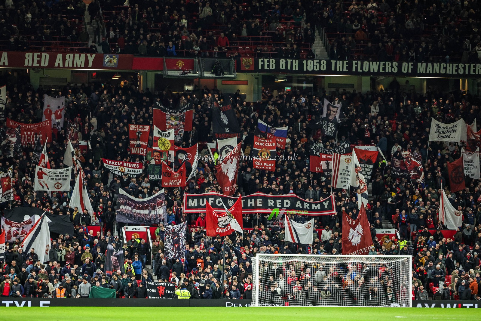 Manchester United wave flags before the game during the Premier League match Manchester United vs Bournemouth at Old Trafford, Manchester, United Kingdom, 15th December 2025

(Photo by Mark Cosgrove/News Images)

*** GER AUT SUI OUT ***