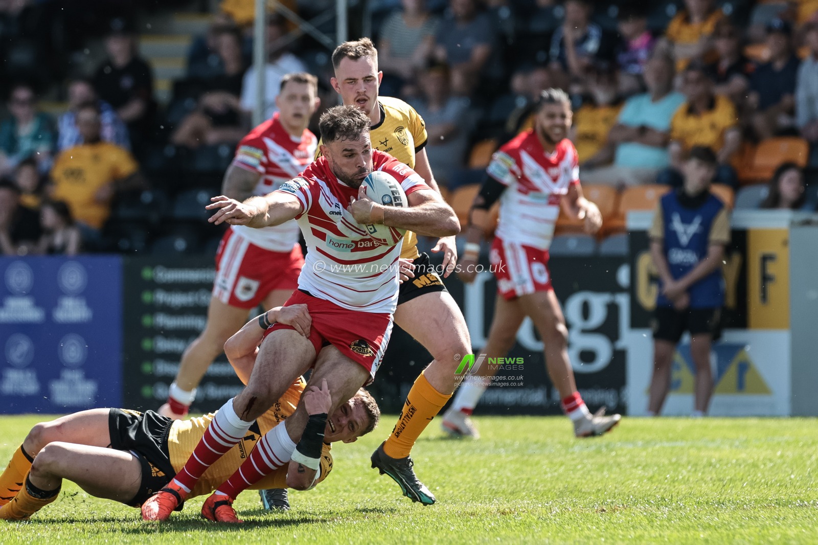 Alex Walmsley of St Helens R.F.C. is tackled during the Betfred Super League round 12 match Castleford Tigers vs St Helens at OneBore Stadium, Castleford, Untied Kingdom on 23 May 2026

(Photo by Mark Cosgrove/News Images)