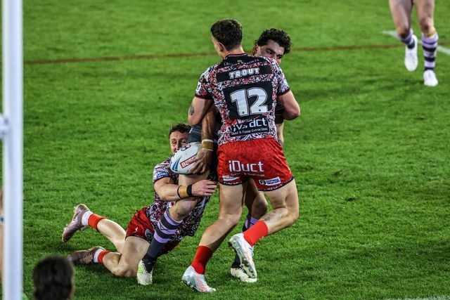 Mathieu Cozza of Huddersfield Giants is tackled by Adam Cook of Leigh Leopards during the Betfred Super League round 9 match Leigh Leopards vs Huddersfield Giants at Leigh Sports Village, Leigh, United Kingdom on 23 April 2026

(Photo by Alfie Cosgrove/News Images)