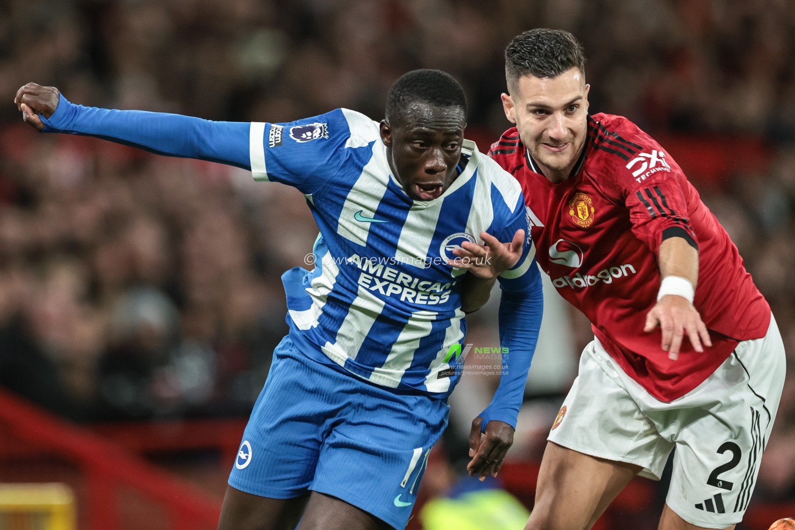 Yankuba Minteh of Brighton & Hove Albion and Diogo Dalot of Manchester United battle for the ball during the Premier League match Manchester United vs Brighton and Hove Albion at Old Trafford, Manchester, United Kingdom, 25th October 2025

(Photo by Mark Cosgrove/News Images)