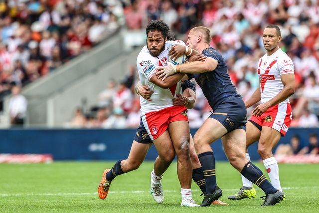 Agnatius Paasi of St. Helens is tackled during the Betfred Super League round 16 match St Helens vs Salford Red Devils at Totally Wicked Stadium, St Helens, United Kingdom, 29th June 2025

(Photo by Alfie Cosgrove/News Images)