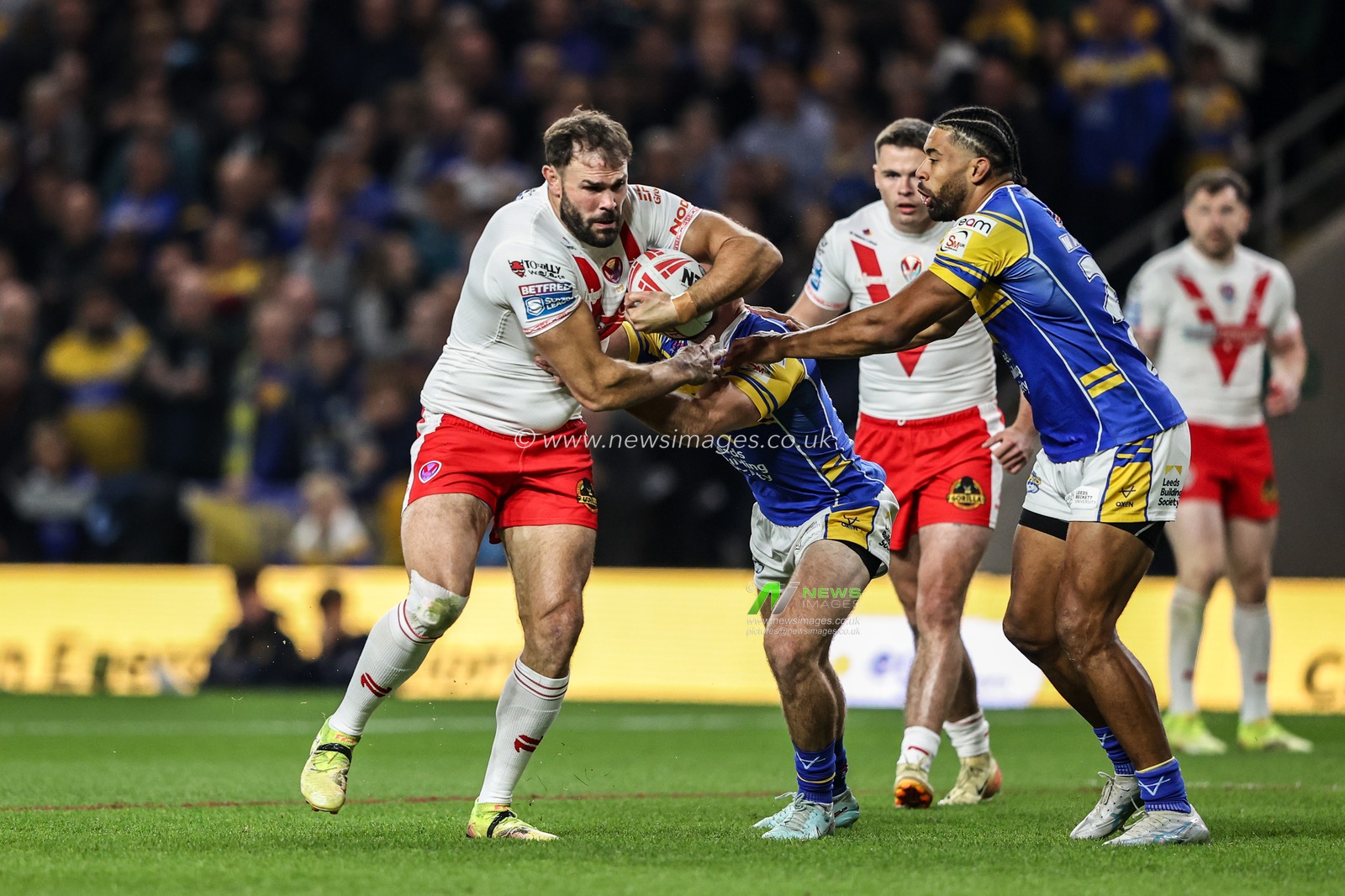 Alex Walmsley of St. Helens is tackled during the Betfred Super League play-off Eliminator 2 match Leeds Rhinos vs St Helens at Headingley Stadium, Leeds, United Kingdom, 27th September 2025

(Photo by Alfie Cosgrove/News Images)