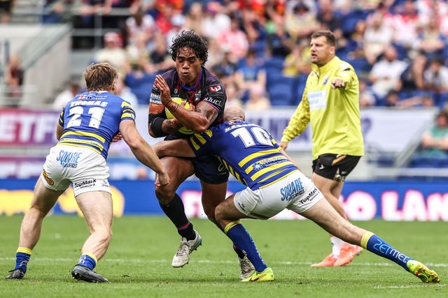 Joe Ofahengaue of Leigh Leopards is tackled by Luke Thomas of Warrington Wolves and James Harrison of Warrington Wolves during the Betfred Super League Magic Weekend match Leigh Leopards vs Warrington Wolves at Leigh Sports Village, Leigh, United Kingdom on 04 July 2026

(Photo by Alfie Cosgrove/News Images)