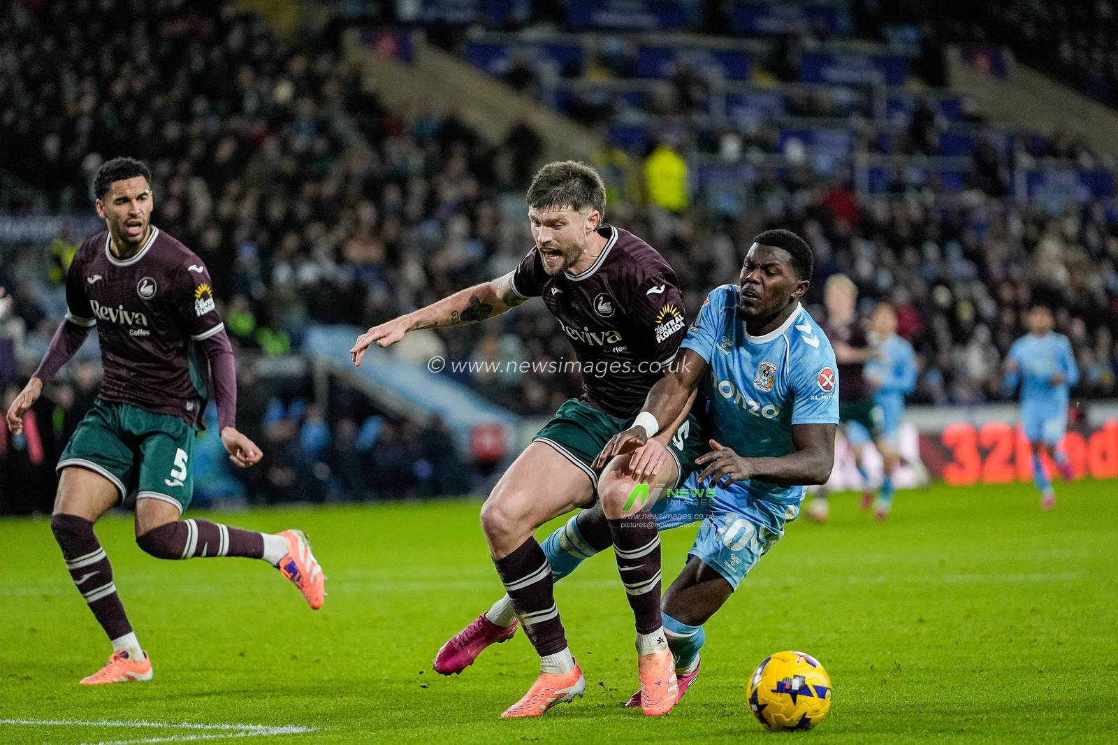 Ephron Mason-Clark, of Coventry City falls to the ground under a challenge from Cameron Burgess, of Swansea City during the Sky Bet Championship match Coventry City vs Swansea City at Coventry Building Society Arena, Coventry, United Kingdom, 26th December 2025

(Photo by Maynard Manyowa/News Images)

*** GER AUT SUI OUT ***