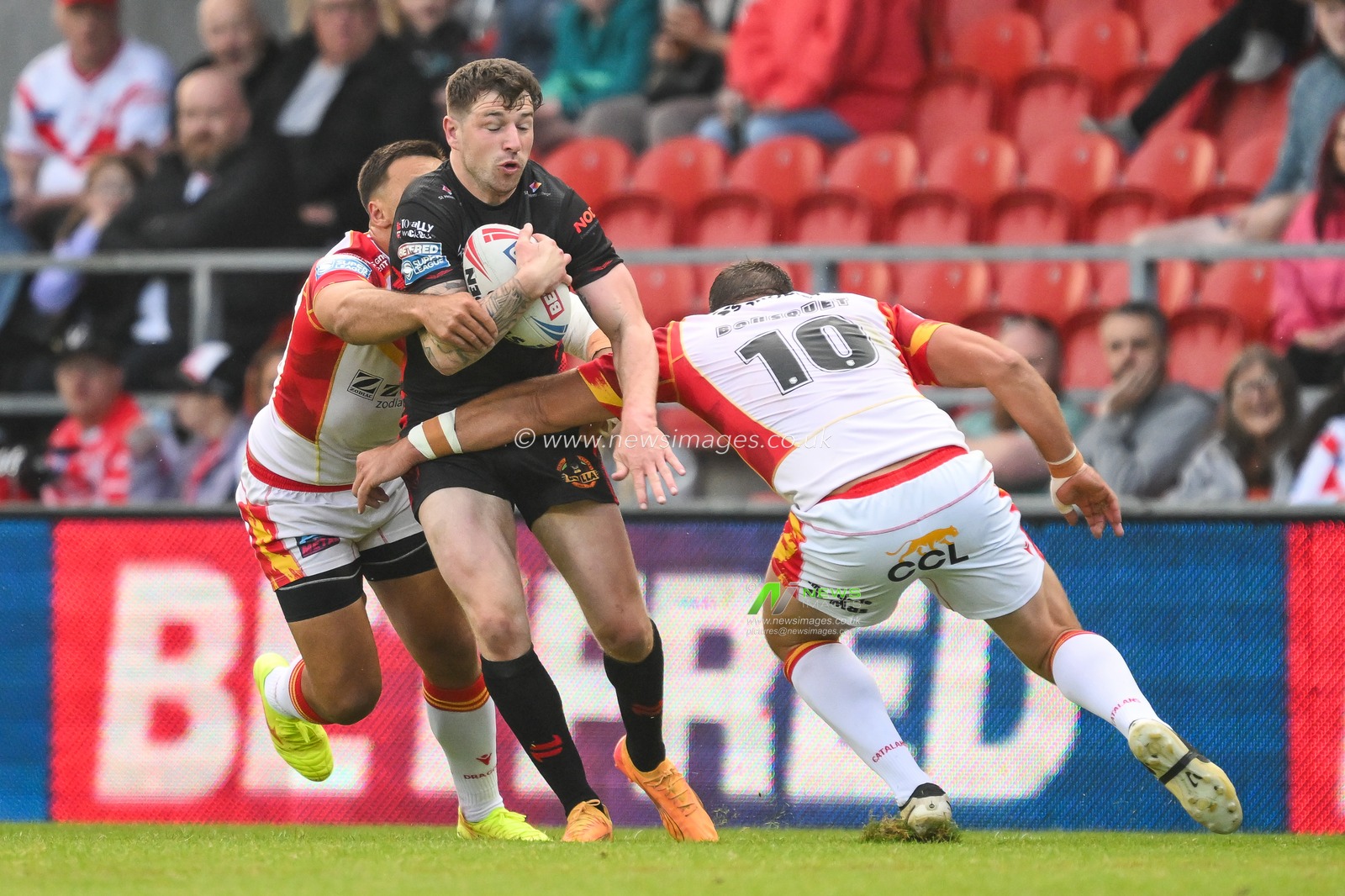Mark Percival of St. Helens is tackled by Julian Bousquet of Catalan Dragons during the Betfred Super League Round 13 match St Helens vs Catalans Dragons at Totally Wicked Stadium, St Helens, United Kingdom, 31st May 2024

(Photo by Craig Thomas/News Images)