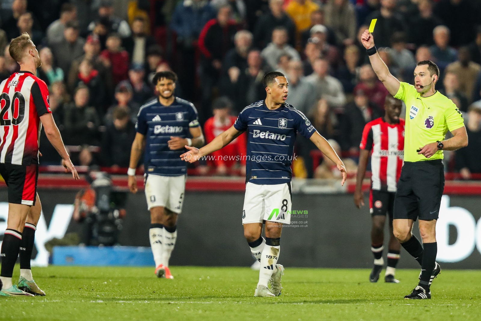 Referee Jarred Gillett shows Kristoffer Ajer of Brentford a yellow card during the Premier League match Brentford vs Aston Villa at The Gtech Community Stadium, London, United Kingdom, 8th March 2025

(Photo by Izzy Poles/News Images)