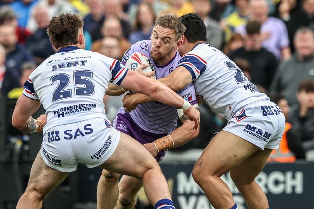 Matt Dufty of Warrington Wolves is tackled during the Betfred Super League Round 11 match Wakefield Trinity vs Warrington Wolves at DIY Kitchens Stadium, Wakefield, United Kingdom, 18th May 2025

(Photo by Alfie Cosgrove/News Images)