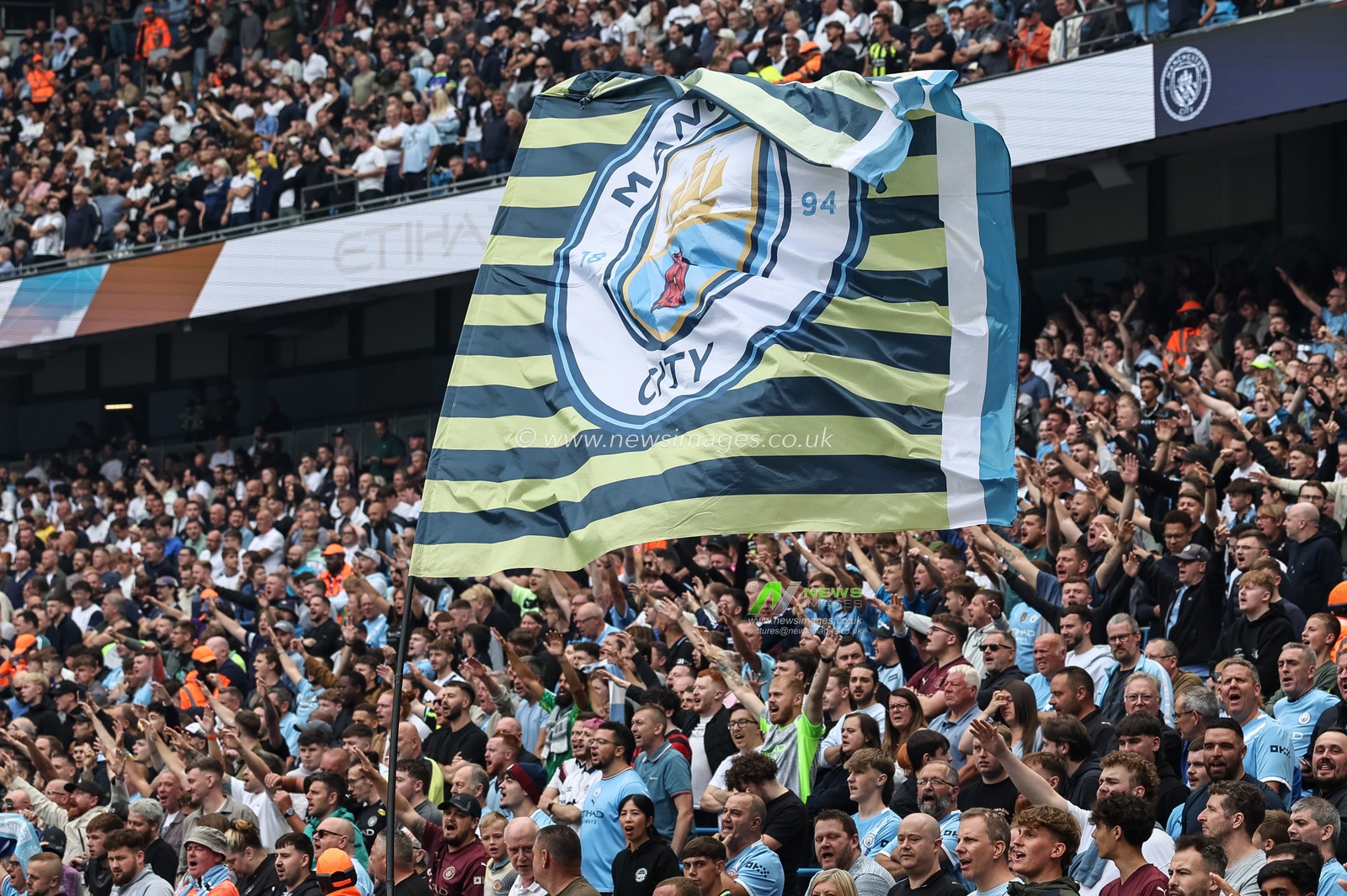 Manchester City fans fly a flag during the Premier League match Manchester City vs Tottenham Hotspur at Etihad Stadium, Manchester, United Kingdom, 23rd August 2025

(Photo by Mark Cosgrove/News Images)
