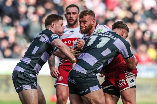 Luke Thompson of Wigan Warriors is tackled by Asher O'Donnell of Huddersfield Giants during the Betfred Super League round 6 match Wigan Warriors vs Huddersfield Giants at The Brick Community Stadium, Wigan, United Kingdom on 28 March 2026

(Photo by Alfie Cosgrove/News Images)