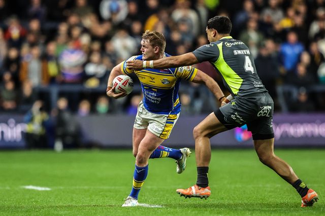 James McDonnell of Leeds Rhinos is tackled by Reimis Smith of Catalan Dragons during the Betfred Super League round 26 match Leeds Rhinos vs Catalans Dragons at Headingley Stadium, Leeds, United Kingdom, 11th September 2025

(Photo by Alfie Cosgrove/News Images)