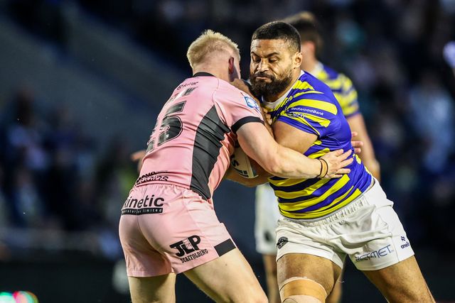 Toafofoa Sipley of Warrington Wolves is tackled by Matty Laidlaw of Hull FC and Joe Batchelor of Hull FC during the Betfred Super League round 13 match Warrington Wolves vs Hull FC at The Halliwell Jones Stadium, Warrington, United Kingdom on 05 June 2026

(Photo by Alfie Cosgrove/News Images)