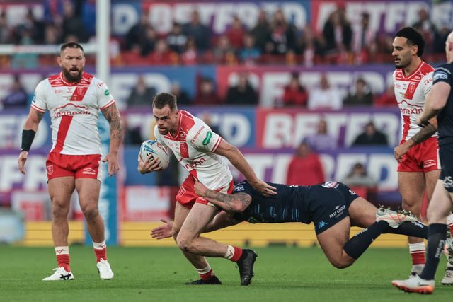 Joe Burgess of Hull KR is tackled by Brad O'neill of Wigan Warriors during the 2025 Betfred Super League Grand Final Hull KR v Wigan Warriors at Old Trafford, Manchester, United Kingdom, 11th October 2025

(Photo by Mark Cosgrove/News Images)