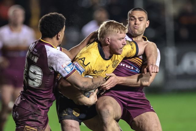Zac Cini of Castleford Tigers is tackled by Tui Lolohea of Huddersfield Giants during the Betfred Super League Round 3 match Castleford Tigers vs Huddersfield Giants at OneBore Stadium, Castleford, Untied Kingdom on 27 February 2026

(Photo by Mark Cosgrove/News Images)