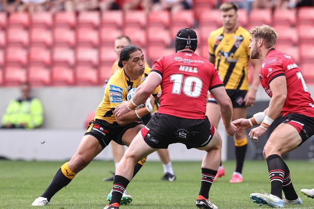 Tom Amone of Castleford Tigers is tackled during the Betfred Super League Round 18 match Salford Red Devils vs Castleford Tigers at Salford Community Stadium, Eccles, United Kingdom, 13th July 2025

(Photo by Alfie Cosgrove/News Images)