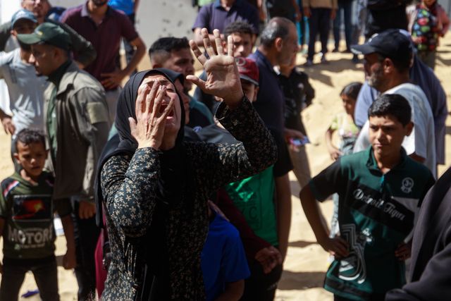 Families bid farewell to their sons killed in today's Israeli massacre at the Al-Wehda Street market in western Gaza City, which left 40 dead and a large number of injuries, including children and women.(Photo: Mohammed Skaik/News Images)